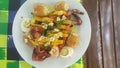 View of a typical Portuguese meal, dish with grilled octopus, potato, egg and garlic, in Portugal it is called polvo ÃÂ  lagareiro